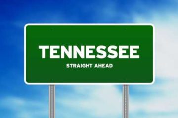 Green road sign reading Tennessee Straight Ahead