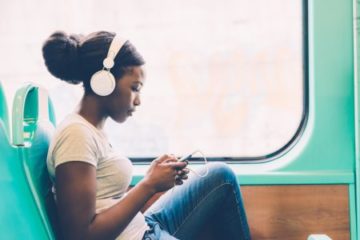 young woman sitting on bus